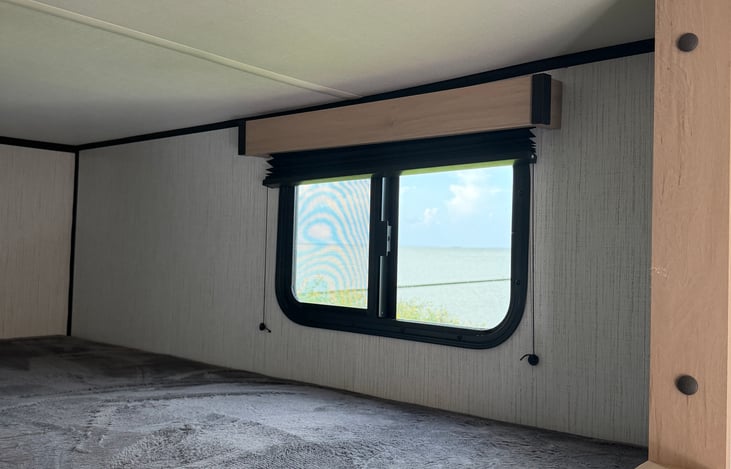 Cozy rear twin bunk beds—the perfect private nook for the kids, extra guests, or storing your bulky adventure gear securely while on the move.