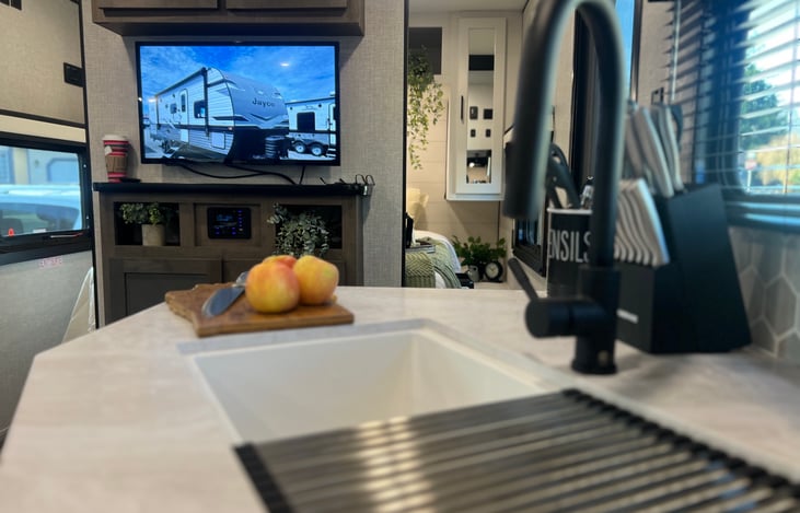 large 2 bowl sink with cutting board and drying rack