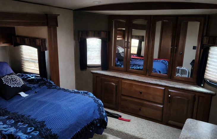 Main bedroom queen size bed, closet, plenty of drawers for storage.