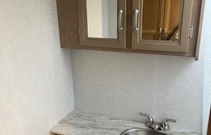 Bathroom sink and cabinet.