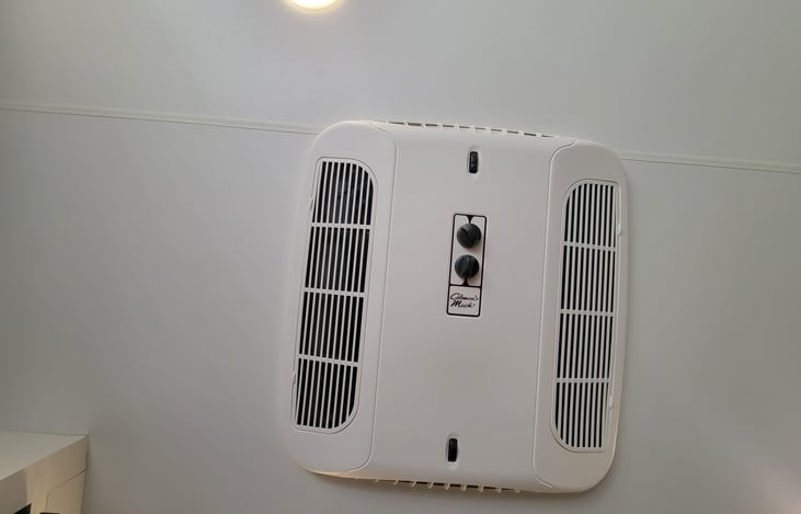 A/C if power hookups are available, or generator as an add-on.  Does not work off-grid.  Needs 120vac