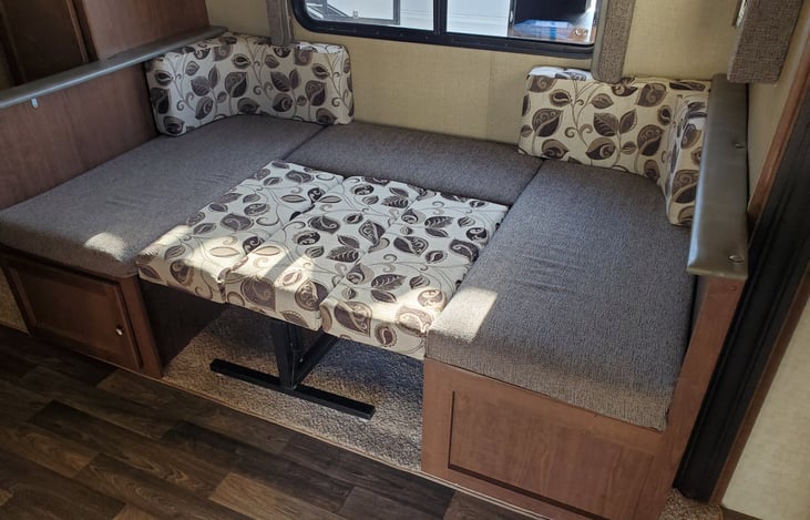 Slideout dining area converts to a full size bed. Can speep to small adults , 2 children, or one large adult