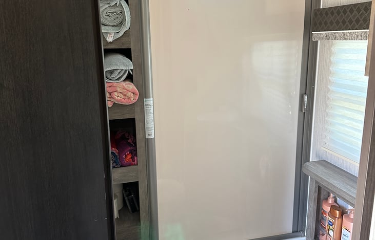 Retractable shower door closed.