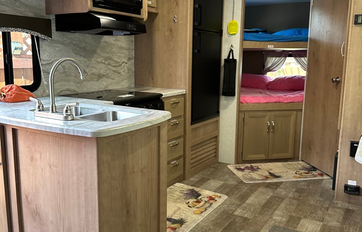 Full kitchen with stove and microwave