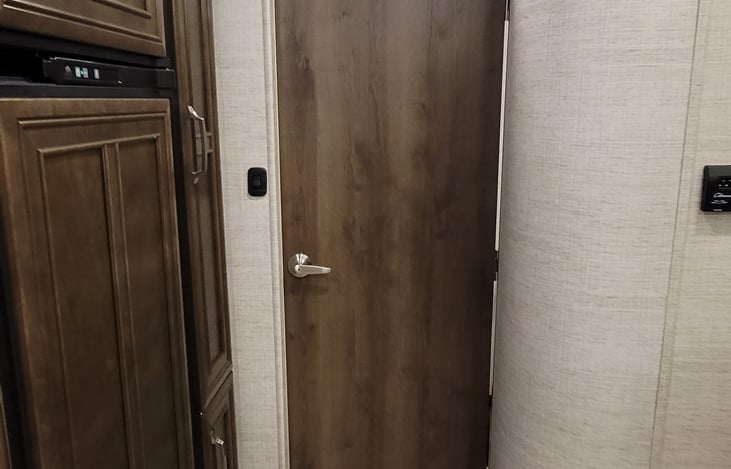 Bathroom door blocking off shower and rear bedroom for complete privacy.