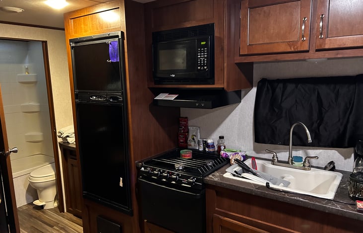 Full gas stove and oven with microwave and a very good refrigerator