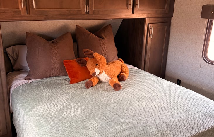 Main bedroom. Sleeps two adults comfortably. TV and walk in bathroom access for convenience.