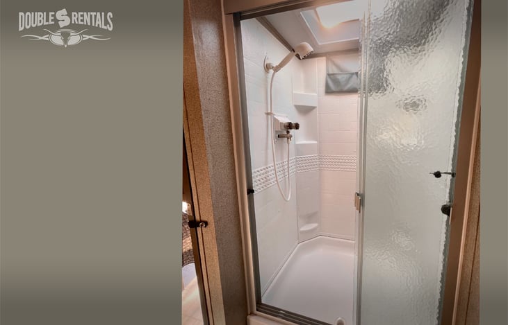 Upgraded Shower Head and Triple Glass Doors