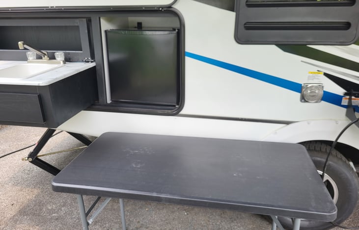 This 4x6 outdoor table is included with rental for additional countertop during meal preparation.