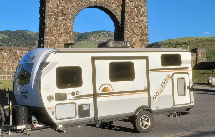 Tilly outside the gates of Yellowstone National Park.