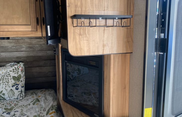 FIREPLACE AND STORAGE SPACES ON WALLS.