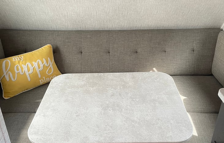 My kids and I spend hours around this table sharing meals when the weather isn’t cooperating or playing card games until the late hours of the night. Table folds down to a sleeping space for two.