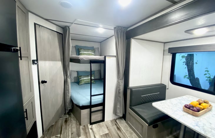 Full bunks next to bathroom