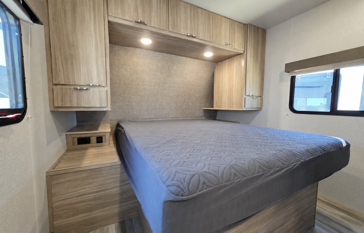 Master Bedroom, queen sized bed. Two nightstand consoles with USB and plug ins.
