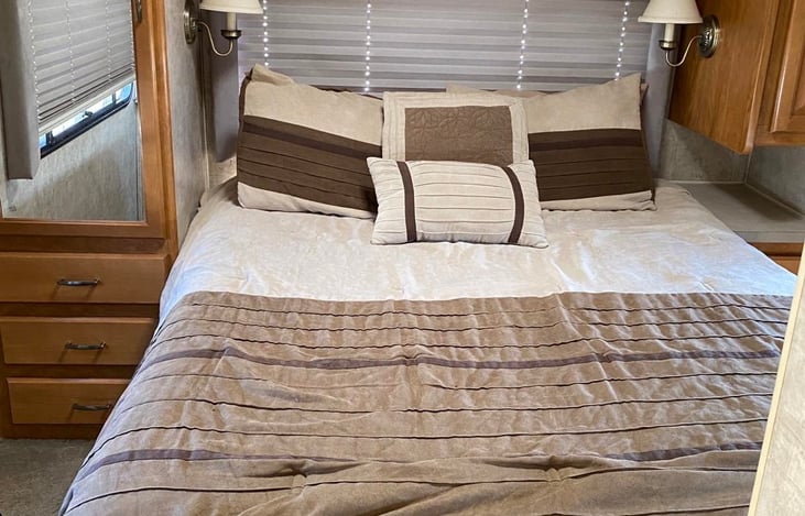 Very comfy queen bed with storage underneath and good size closets with mirrored door.