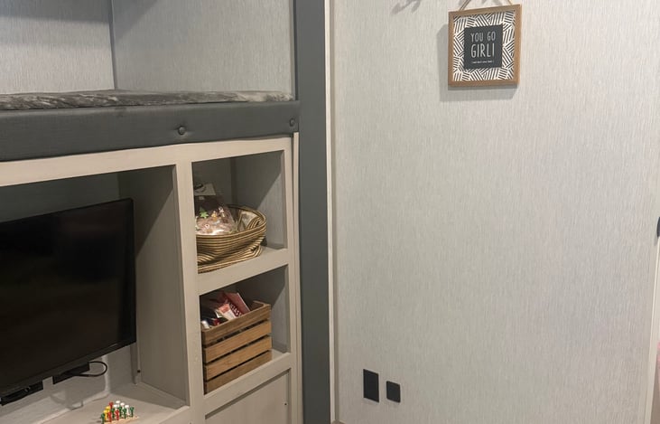 Bunk above and Books and games below