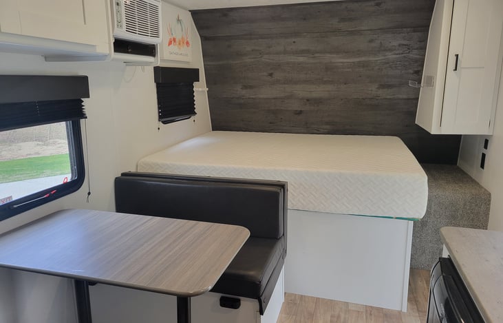Dinette converts to short twin/full bed. Queen with 5" upgraded memory foam mattress. A/C and heat