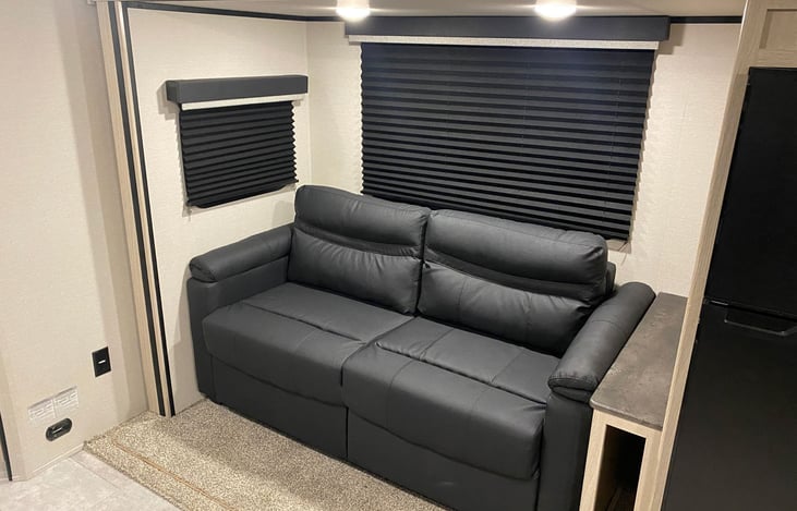 Hide-a-bed sofa with end table