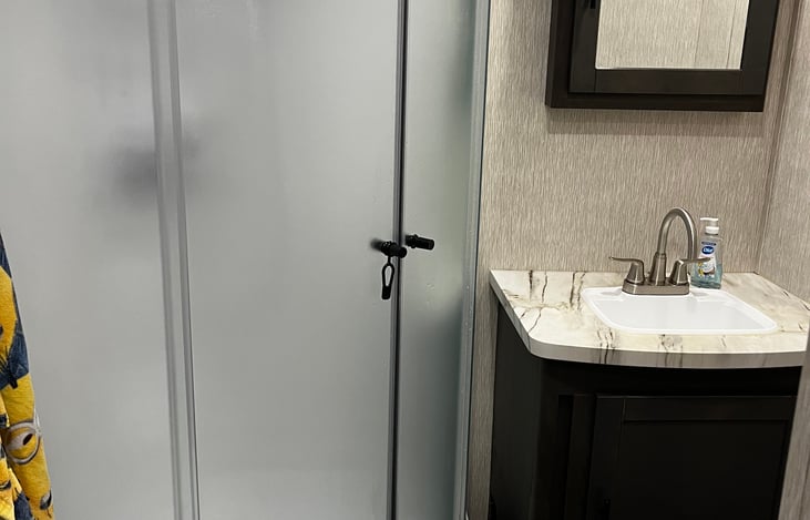 Full bathroom, shower, toilet, sink and plenty of linens.