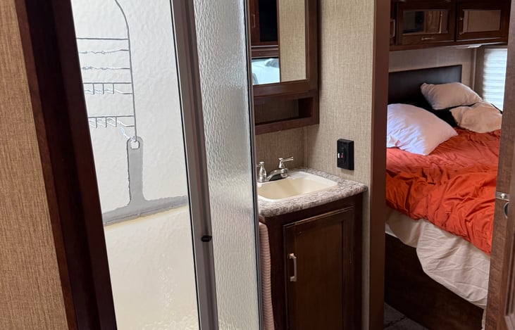 Fill bathroom with a great standup shower, full size toilet and medicine cabinet over the sink