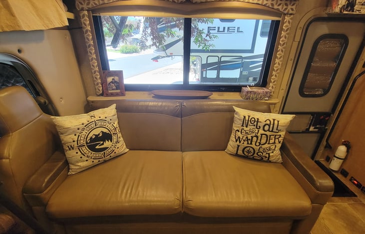Look, the bed is also a couch,  man this RV is AMAZING