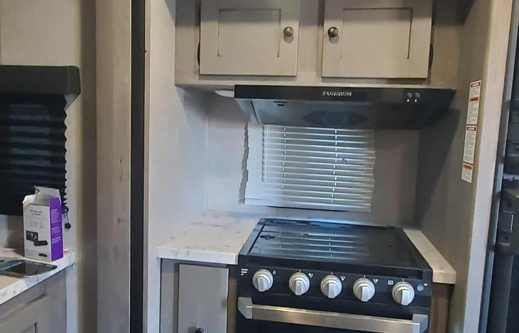 stove with oven and microwave for cooking