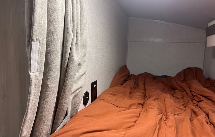 This is a shot of the top bunk. Each bunk has an outlet and USB charging port.
