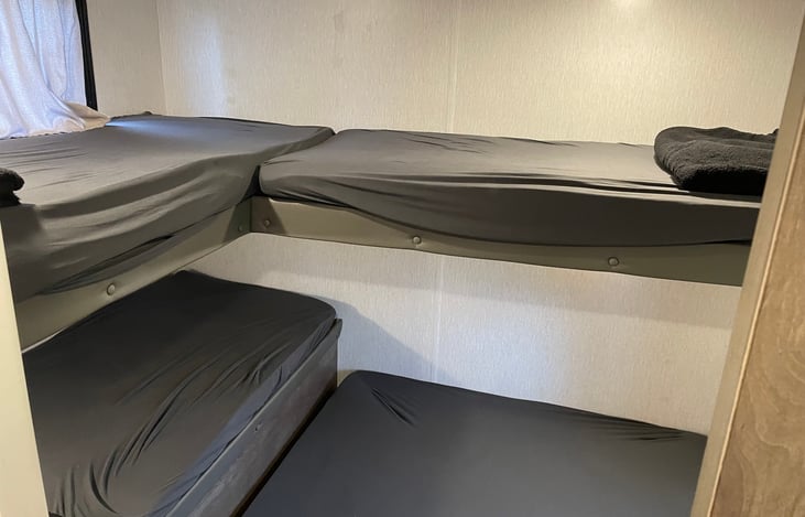 3 twin beds in rear bedroom.