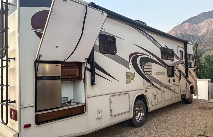 Enjoy the Outdoors with Our Convenient Outside Mini Kitchen! There's also an outdoor TV to watch your favorite sports team or favorite movie under the stars.