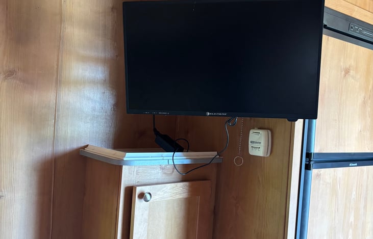 TV does have an extendable hanger you can put at different angles