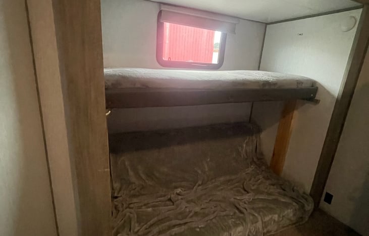 Rear bedroom, lower bed slides down can sleep 2.
-Bunk bed 1 of 2 sleeps 1