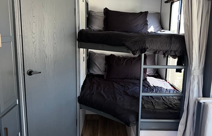 Full sized bunks with pillows and bedding. Each bed has its own ac outlet as well as dual 12v usb outlets. *trailer must be hooked up to electric hook ups or generator for ac power outlets*