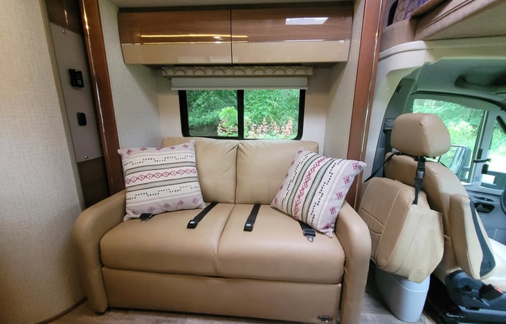 The sofa is in the slide out and makes into a double bed. Sports two seat belts for passengers.