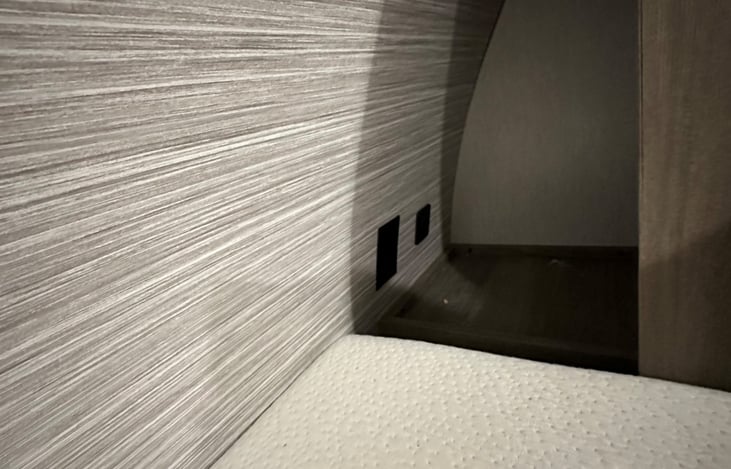 Night stand / CPAP area behind side closet with 120v outlet and USB charger ports for your phone or other items that need to be plugged in.