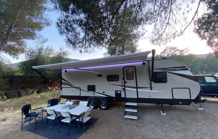 Table and chair set up with awning extended