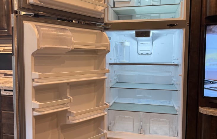 full size residential fridge and freezer with icemaker in freezer