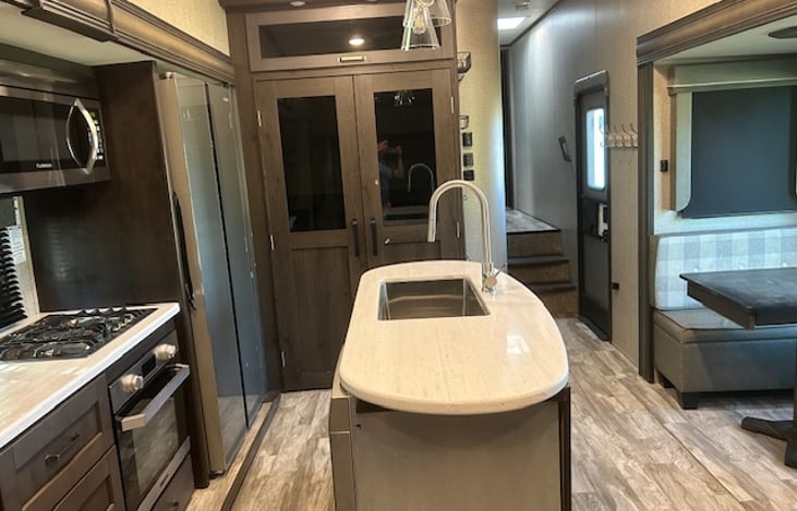 Kitchen; larger oven has two racks (as opposed to just one), large pantry, dishwasher installed!