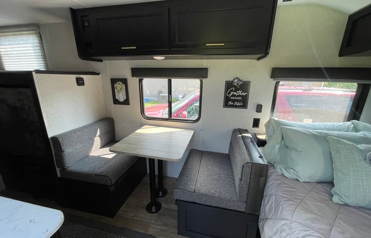 Dining room table folds into bed, storage below