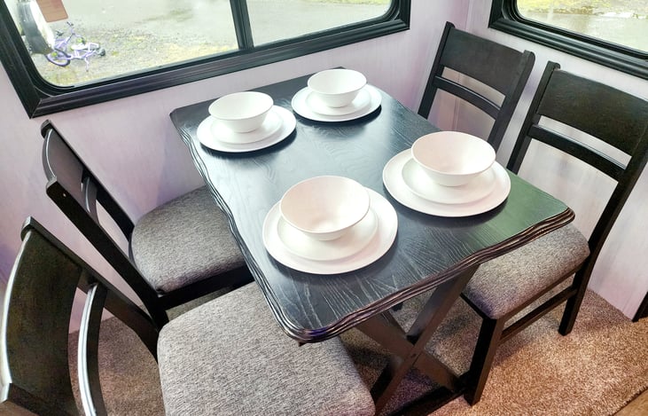 Kitchen stocked with reusable plates, bowls & cups