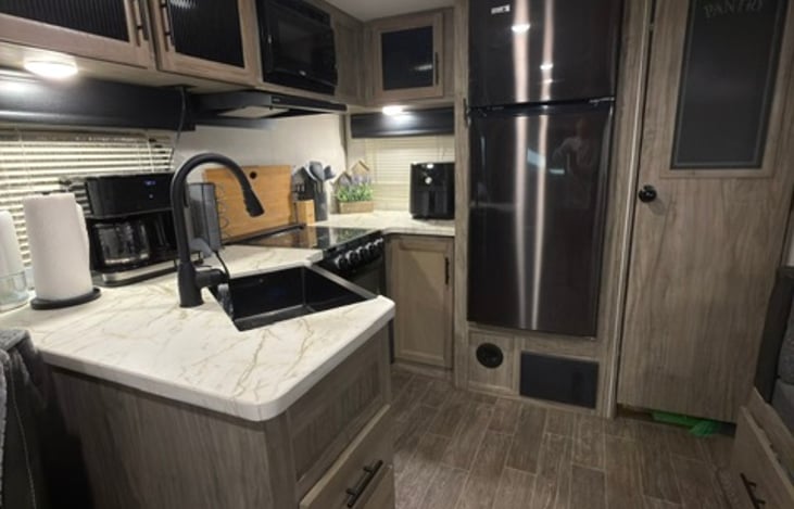 Kitchen with Full Size Refrigerator, Coffee Pot with Keurig and Air Fryer.