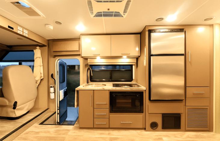 Full kitchen with fridge, microwave, and sink – RV rental made easy across Southern California
