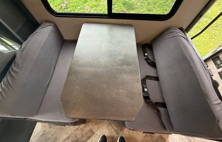 The kitchen table and the game table. Many games have been played on this table. Two more seatbelts suitable for Car seats to attach to. So much family fun at this table.