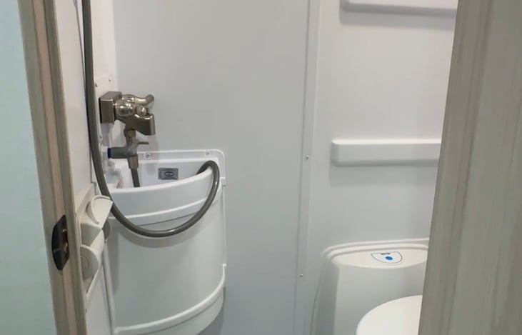 All in one shower/sink/toilet combo. Shower works but has never been used! We always use the shower provided at campgrounds instead. This is a great place to hang clothes or towels to dry.