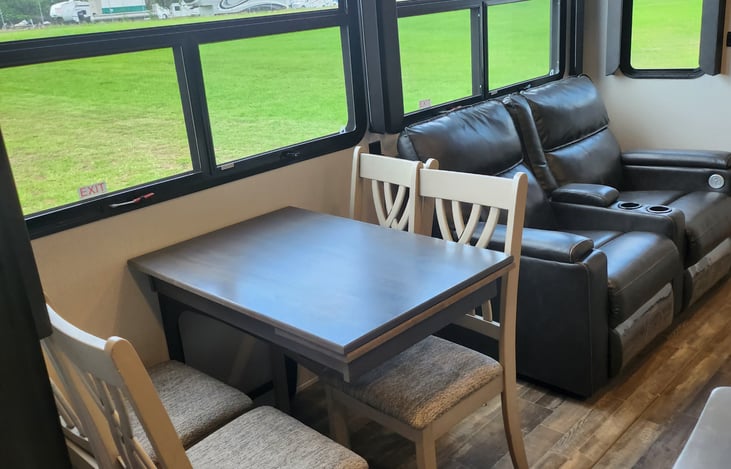 Dining table with messaging recliners to relax while enjoying family time