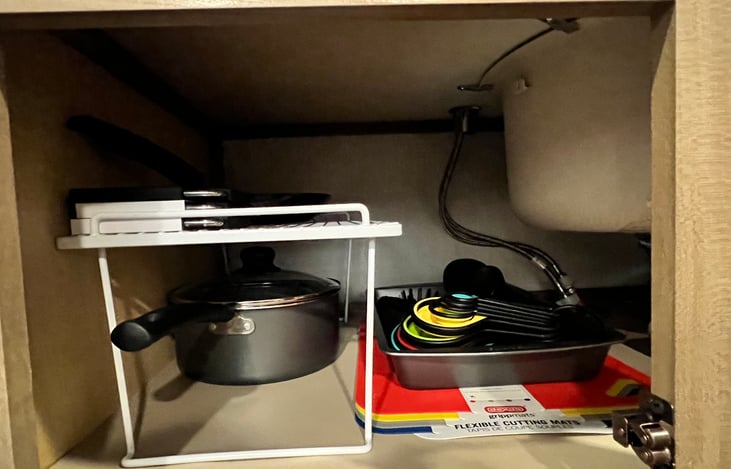 Pots and pans, cutting boards and collapsable measuring cups