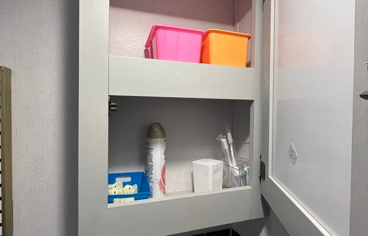 Storage behind bathroom mirror