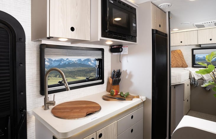 Has a portable induction cooktop to allow more counter space usage when not being used.