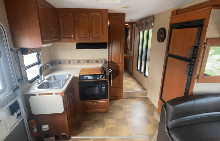 Kitchen area with fold up counters at each end of the counter!