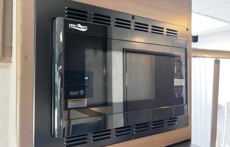 Built in microwave conveniently located right above refrigerator and freezer.