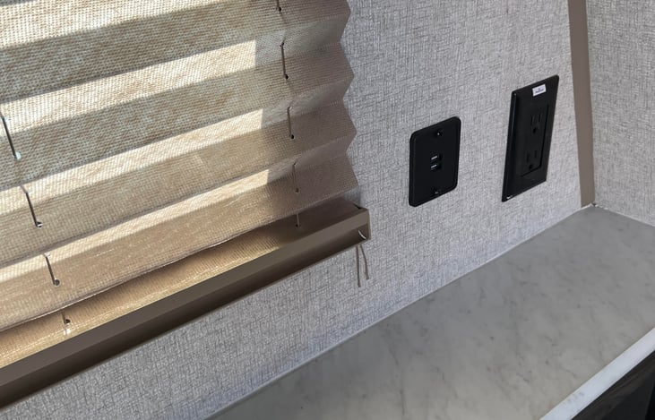 Electrical outlet, cell phone charger outlet, and storage in headboard of full-size bed